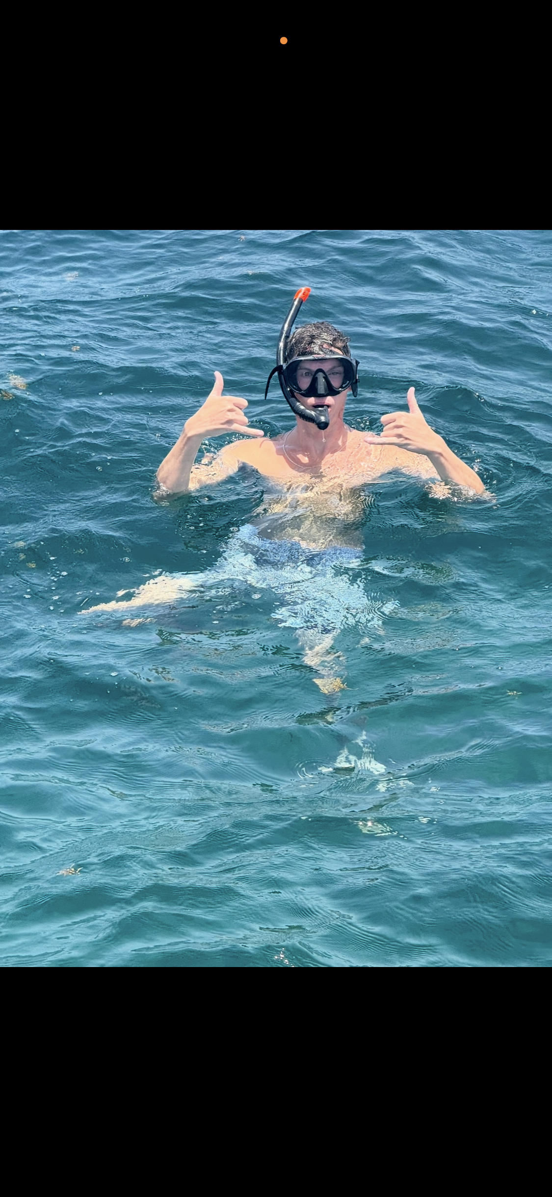 Drew snorkeling in the water